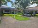 Charming residential property featuring a carport, well-manicured lawn, and tasteful landscaping at 2055 Lakeview Dr, Clearwater, FL 33763