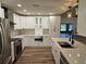 Spacious renovated kitchen featuring stainless appliances, custom cabinets, and modern countertops at 2055 Lakeview Dr, Clearwater, FL 33763