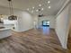 Open-concept living room with modern lighting, vaulted ceilings, and wood flooring at 2055 Lakeview Dr, Clearwater, FL 33763