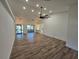Open floor plan with high ceilings, modern light fixture, hardwood flooring and lots of natural light at 2055 Lakeview Dr, Clearwater, FL 33763