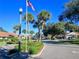 Street view showcasing lush landscaping and well-maintained homes in the community at 2055 Lakeview Dr, Clearwater, FL 33763