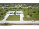 Overview of the community featuring similar houses with screened in pools and well-kept lawns at 223 Rotonda S Blvd, Rotonda West, FL 33947