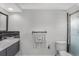 Bathroom with modern double sink vanity, toilet and walk-in shower at 4043 Topsail Trl, New Port Richey, FL 34652