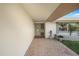 Inviting front entrance featuring a tiled walkway, well-kept lawn and decorative plant at 4043 Topsail Trl, New Port Richey, FL 34652