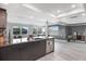 Open floor plan with kitchen island, modern lighting, and stainless dishwasher at 4043 Topsail Trl, New Port Richey, FL 34652