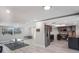 Open-concept living room and kitchen with modern flooring and stainless steel appliances at 4043 Topsail Trl, New Port Richey, FL 34652