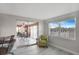 Cozy sun room with sliding glass doors leading to an outdoor area, brightened by a large window at 4043 Topsail Trl, New Port Richey, FL 34652