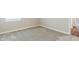 Bedroom with neutral walls, carpeted floor, a window and white trim at 507 Daylily Blvd, Nokomis, FL 34275
