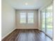 Eat-in kitchen area features natural light and a sliding door to backyard at 507 Daylily Blvd, Nokomis, FL 34275