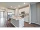 Modern kitchen features stainless steel appliances, an island and white cabinets at 507 Daylily Blvd, Nokomis, FL 34275