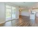 Spacious living area with access to outdoor patio and kitchen area at 507 Daylily Blvd, Nokomis, FL 34275