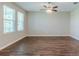 Spacious living room with hardwood floors, fan and natural lighting at 507 Daylily Blvd, Nokomis, FL 34275