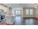Open-concept living area with modern finishes and wood flooring at 507 Daylily Blvd, Nokomis, FL 34275