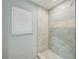 The bathroom has an updated shower with tiled walls, and a window at 5817 26Th W St, Bradenton, FL 34207