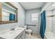 Bathroom featuring new vanity with white sink, tile floor, updated mirror and shower at 5817 26Th W St, Bradenton, FL 34207