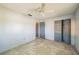 Bedroom showcasing tile floors, ceiling fan, and closet for storage space at 5817 26Th W St, Bradenton, FL 34207
