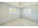 The bedroom features new floors, ceiling fan, and a big window at 5817 26Th W St, Bradenton, FL 34207