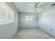 This bedroom has new flooring, ceiling fan, and natural light from two windows at 5817 26Th W St, Bradenton, FL 34207