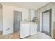 Practical laundry room with washer, dryer, and tile flooring for easy maintenance at 5817 26Th W St, Bradenton, FL 34207