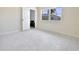 Bright bedroom with neutral walls, double hung window and light colored terrazzo flooring at 5186 Fleming St, Port Charlotte, FL 33981