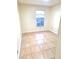 Bright bedroom featuring tile flooring, a large window, and neutral walls at 2202 Whitney Pl, Valrico, FL 33594