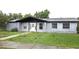 Charming single story home with a stone accent wall and well-maintained lawn at 2202 Whitney Pl, Valrico, FL 33594