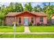 Charming single-story home featuring a well-manicured lawn, stone accents, and inviting front porch at 2202 Whitney Pl, Valrico, FL 33594
