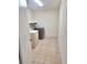 Laundry room with tile flooring, washer, dryer, and built-in shelving at 2202 Whitney Pl, Valrico, FL 33594