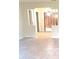 Open living room featuring tile flooring, decorative columns and an open view into the dining area at 2202 Whitney Pl, Valrico, FL 33594