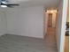 Living room featuring gray vinyl flooring and white walls at 3716 Mistwood Dr, Tampa, FL 33619