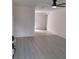 Living room featuring gray vinyl flooring and white walls at 3716 Mistwood Dr, Tampa, FL 33619