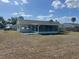 Back exterior view featuring a screened porch, showcasing the property's outdoor living spaces at 5052 Trekell St, North Port, FL 34287
