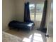 Bedroom with a bed and curtains at 5052 Trekell St, North Port, FL 34287