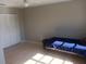 Bedroom features neutral walls, a large closet, and a ceiling fan at 5052 Trekell St, North Port, FL 34287
