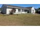Charming single-story home with a well-maintained lawn and white-trimmed windows at 5052 Trekell St, North Port, FL 34287