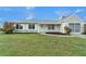 Inviting single-story home features a lovely front yard with beautiful lawn at 5052 Trekell St, North Port, FL 34287