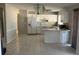 Bright eat-in kitchen with lots of tile, white cabinets, and ample counter space at 5052 Trekell St, North Port, FL 34287