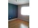 Bedroom with laminate floors and a bright window at 2011 N 61St St, Tampa, FL 33619