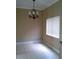 Dining area with tile floors, a chandelier and a window at 2011 N 61St St, Tampa, FL 33619