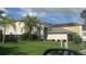 Two story home with a well maintained lawn and mature trees at 2011 N 61St St, Tampa, FL 33619