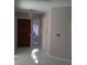 Home entrance with tile floor, front door, and side window at 2011 N 61St St, Tampa, FL 33619