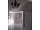 Open-concept living space with tile flooring, neutral paint, and large windows for ample lighting at 2011 N 61St St, Tampa, FL 33619