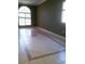 Spacious living room with tile floors and plenty of natural light from the windows at 2011 N 61St St, Tampa, FL 33619