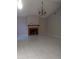 Spacious living room featuring a tiled floor, fireplace, and chandelier lighting at 2011 N 61St St, Tampa, FL 33619