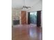 Inviting living room with a vaulted ceiling, stone fireplace, and natural light from large window at 2011 N 61St St, Tampa, FL 33619