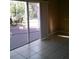 Inviting living room with tile flooring and sliding glass doors opening to the backyard patio at 2011 N 61St St, Tampa, FL 33619