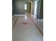 Open living room with tile floors and a view to the next room and beyond at 2011 N 61St St, Tampa, FL 33619