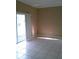 Bright living room featuring tile flooring and sliding glass doors to enjoy natural light at 2011 N 61St St, Tampa, FL 33619