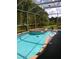 Relaxing screened in-ground pool and jacuzzi in a lush backyard setting at 2011 N 61St St, Tampa, FL 33619