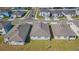 Aerial view of single-Gathering homes showcasing backyard, roofing, and neighborhood streets at 9661 Summers Cay Cir, Thonotosassa, FL 33592